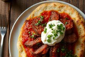 Iskender Kebab with tomato sauce and yogurt