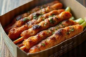 Takeaway food container with kebabs